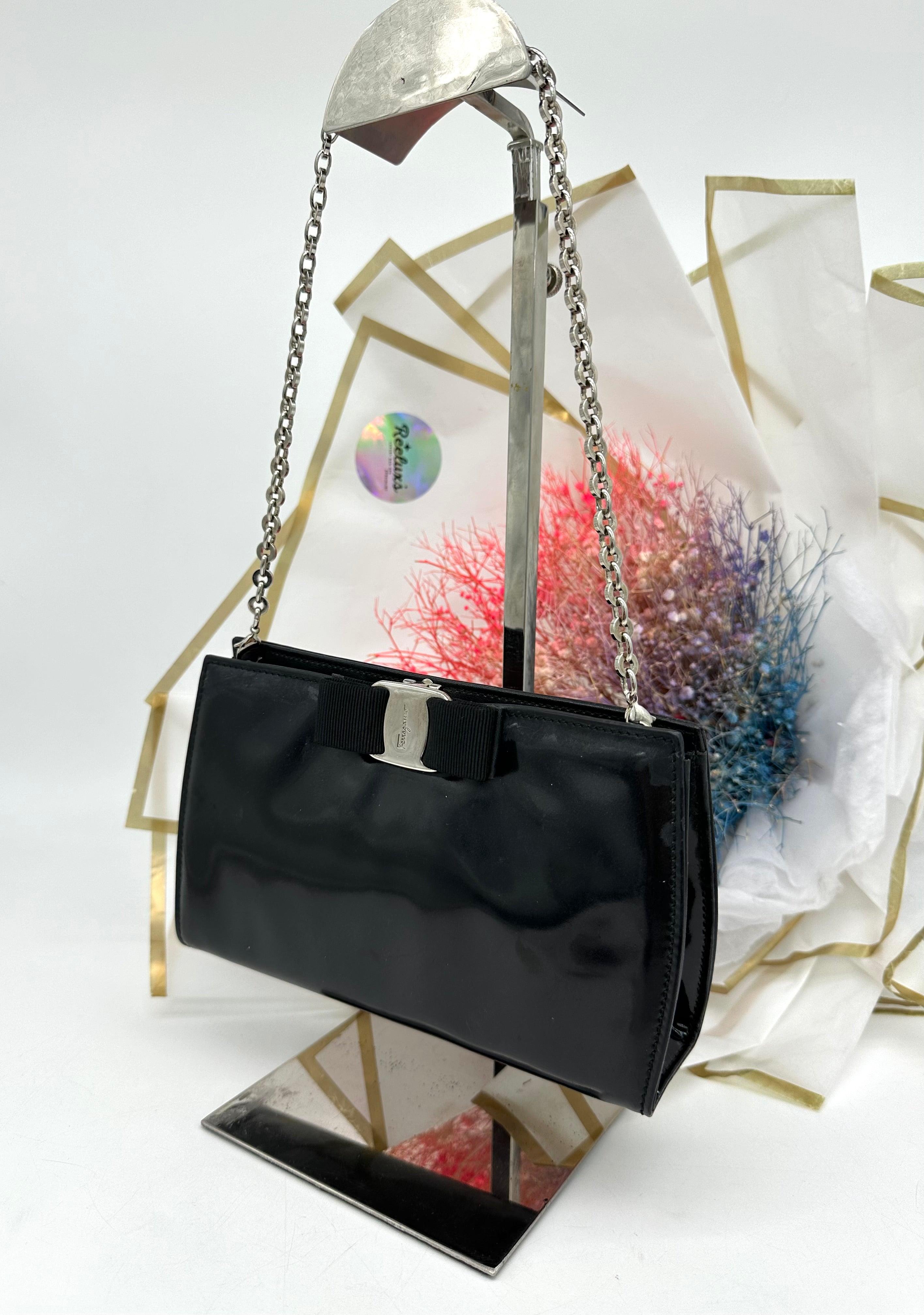SALVATORE FERRAGAMO
Black Patent Miss Vara Bow Clutch Bag - Reeluxs