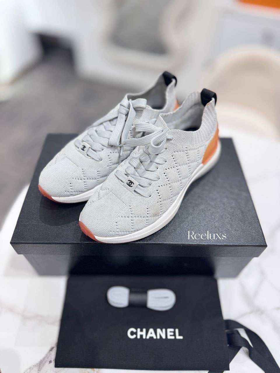 Chanel Quilted Low-Top Sneakers in White Wool