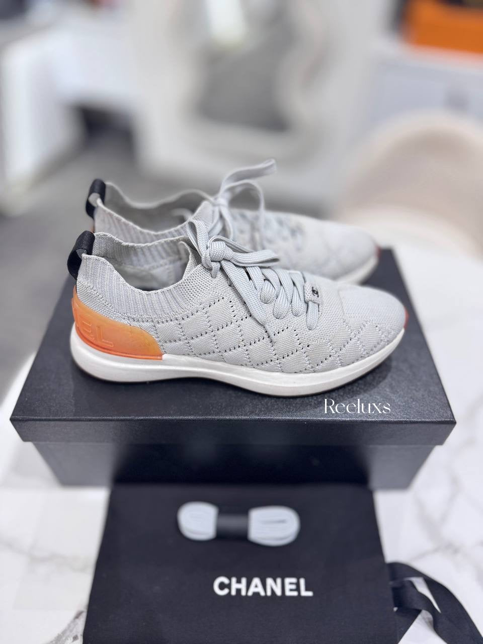 Chanel Quilted Low-Top Sneakers in White Wool