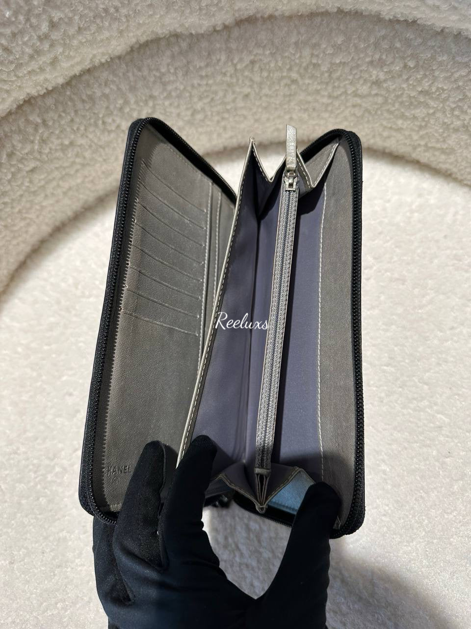 CHANEL Lambskin Camellia Embossed Zip Around Organizer Wallet Black