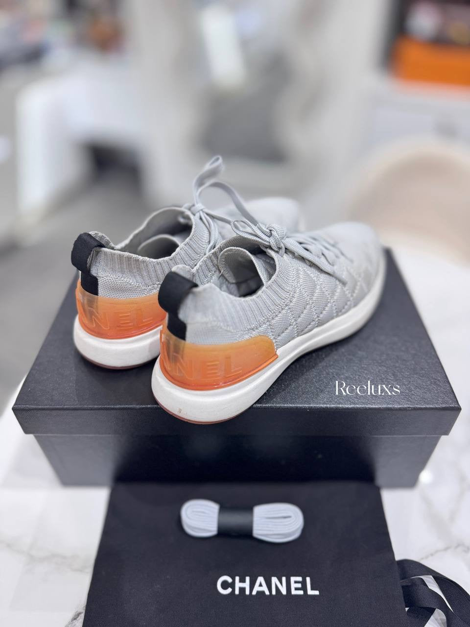 Chanel Quilted Low-Top Sneakers in White Wool