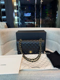 Chanel Classic Flap Bag in Black Caviar leather with gold-tone hardware