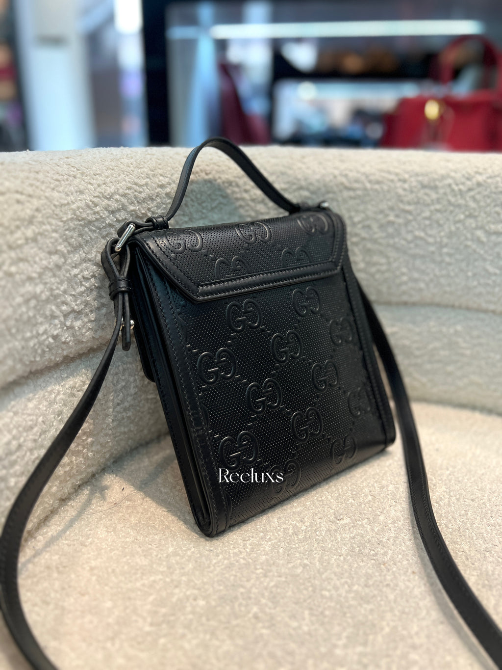 GUCCI GG Embossed Messenger Bag