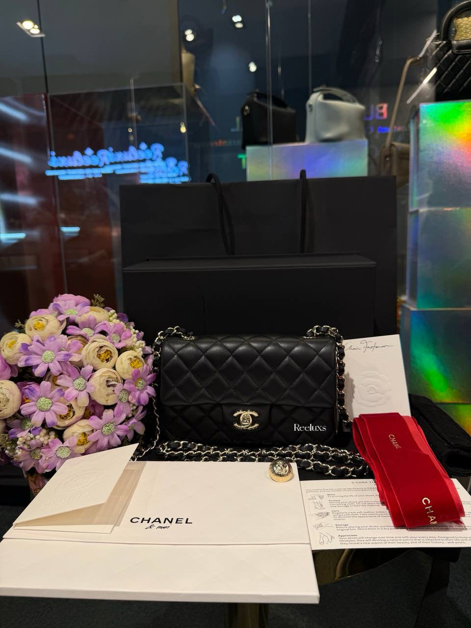 Chanel Classic Mini Flap Bag in black lambskin leather