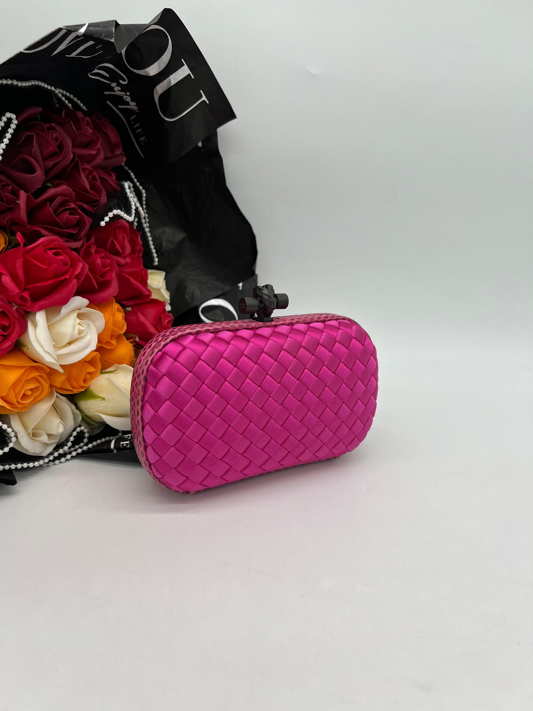 BOTTEGA VENETA Intrecciato Knot Clutch in Fuchsia Silk - Reeluxs 