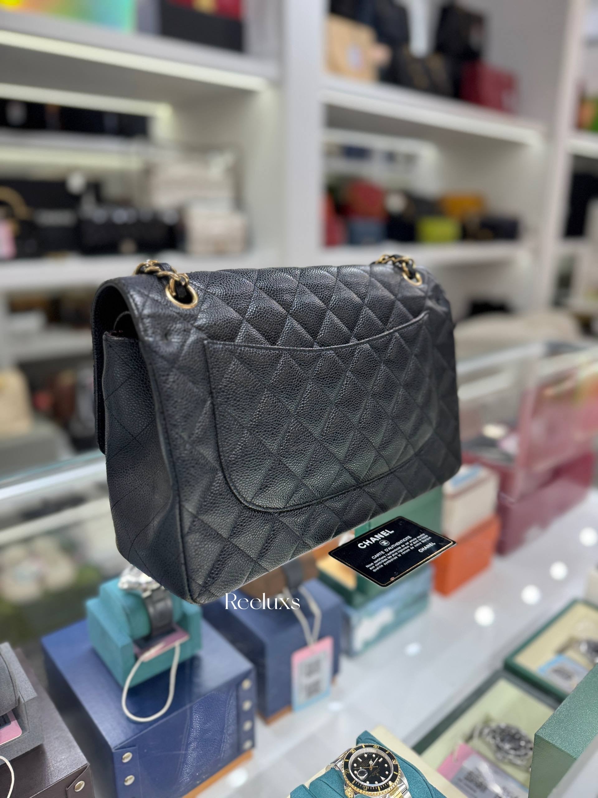 CHANEL Classic Jumbo Flag Bag In Black Quilted Caviar Leather