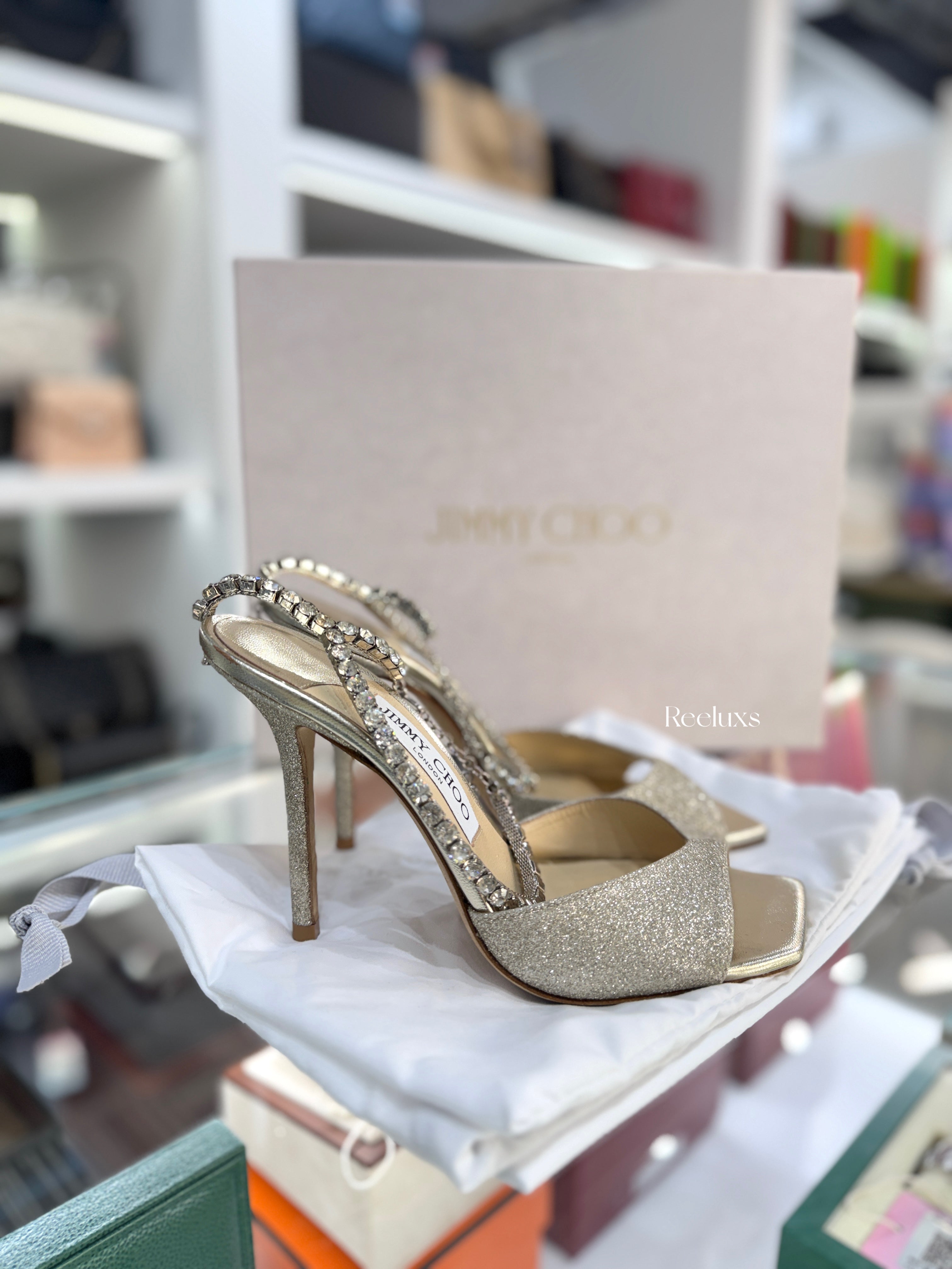 JIMMY CHOO Saeda 100 Sandals in a Platinum Ice Glitter