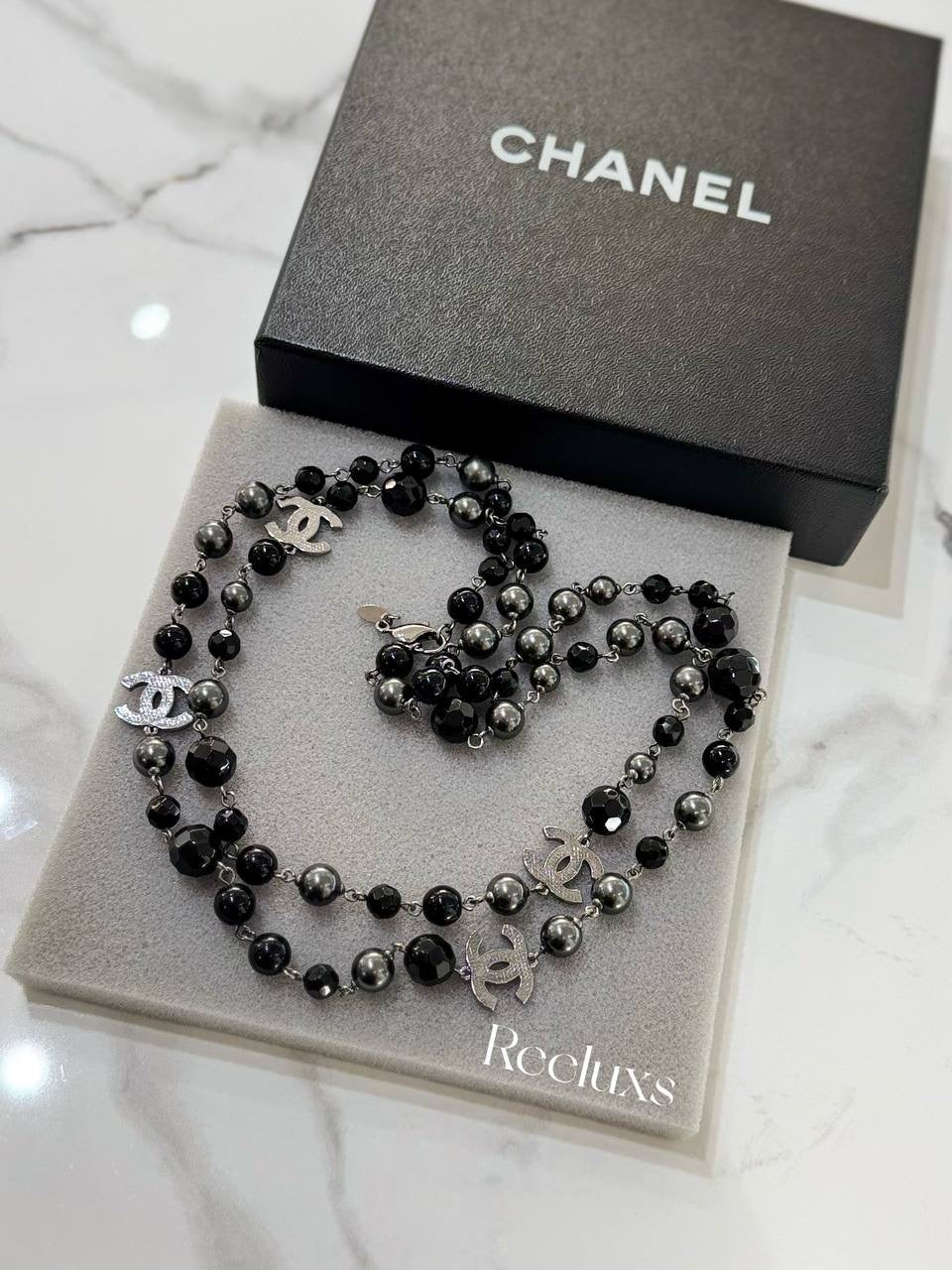 CHANEL Black And Grey Beaded Triple CC Long Necklace