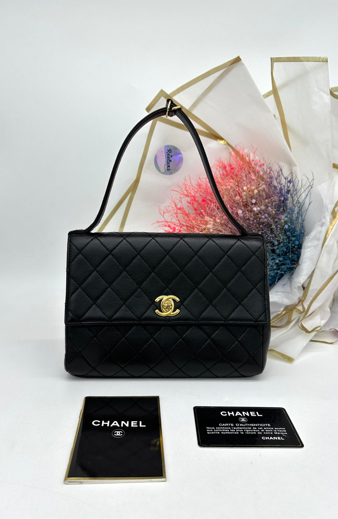 CHANEL Black Quilted Lambskin Vintage Classic Top Handle Clutch - Reeluxs 