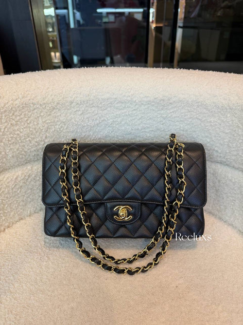 Chanel Classic Flap Bag in Black Caviar leather with gold-tone hardware