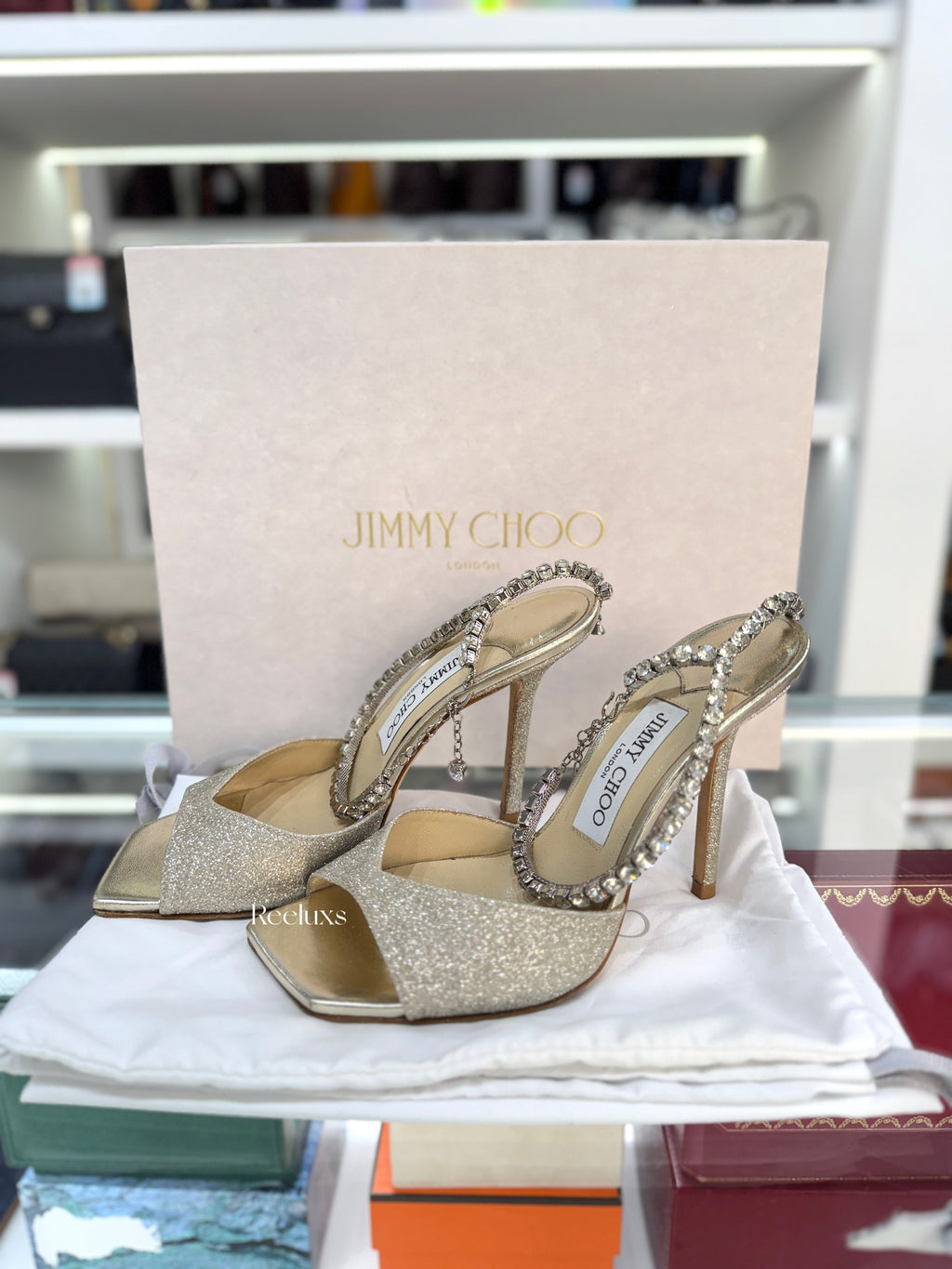JIMMY CHOO Saeda 100 Sandals in a Platinum Ice Glitter