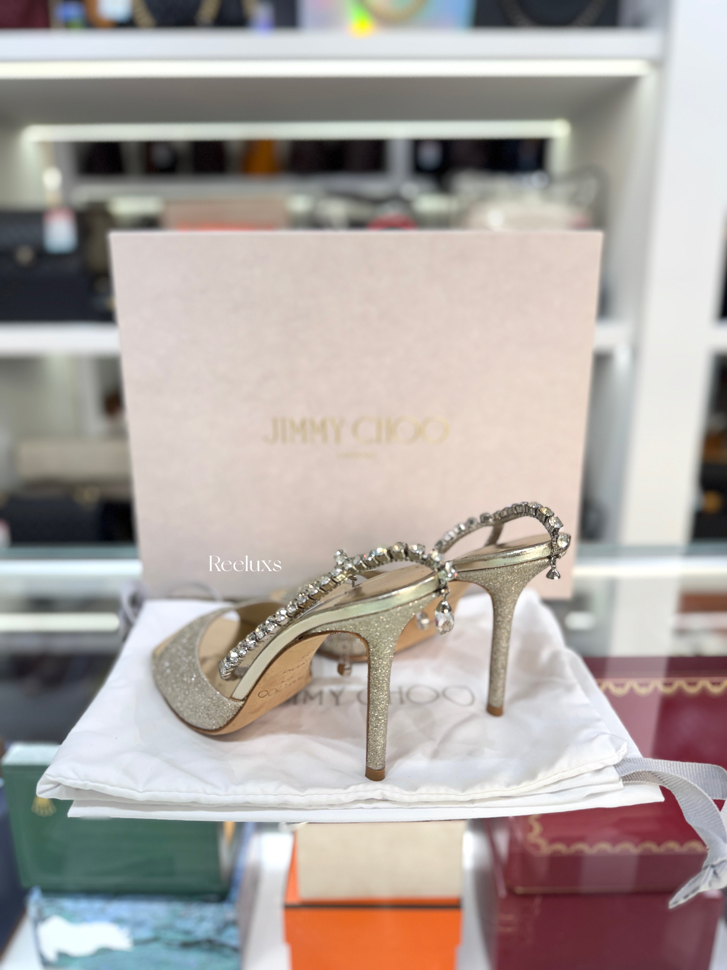 JIMMY CHOO Saeda 100 Sandals in a Platinum Ice Glitter