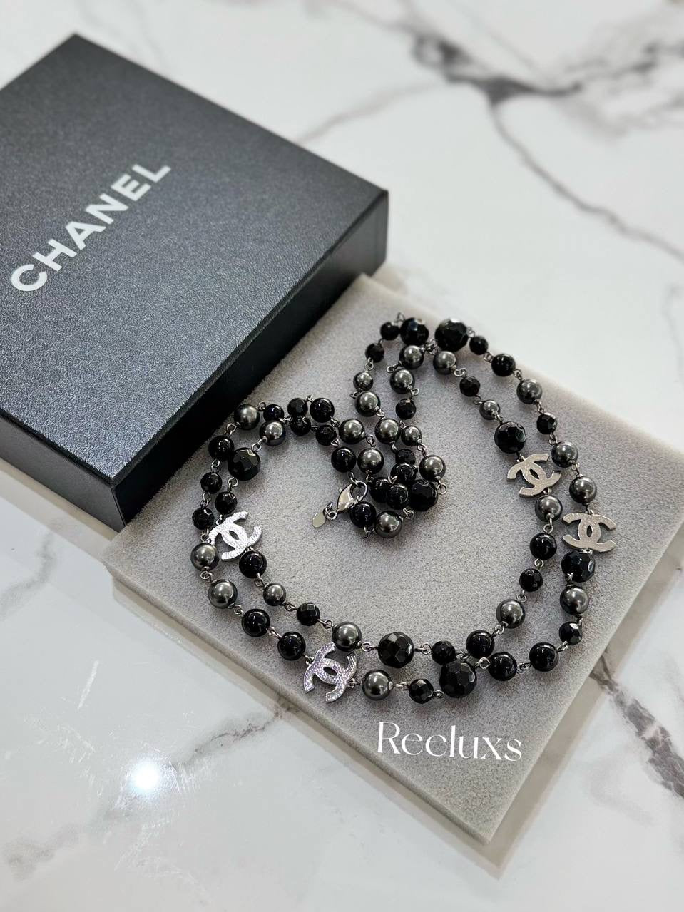 CHANEL Black And Grey Beaded Triple CC Long Necklace