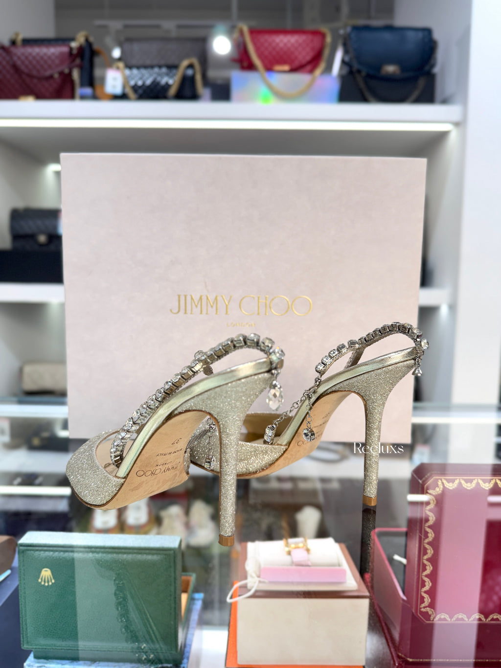 JIMMY CHOO Saeda 100 Sandals in a Platinum Ice Glitter