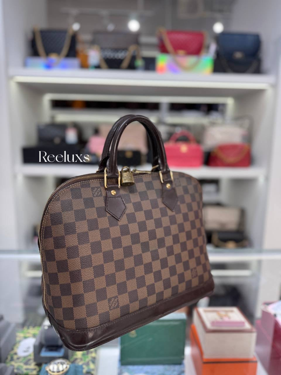 LOUIS VUITTON Alma PM Handbag in Damier Ebene Coated Canvas