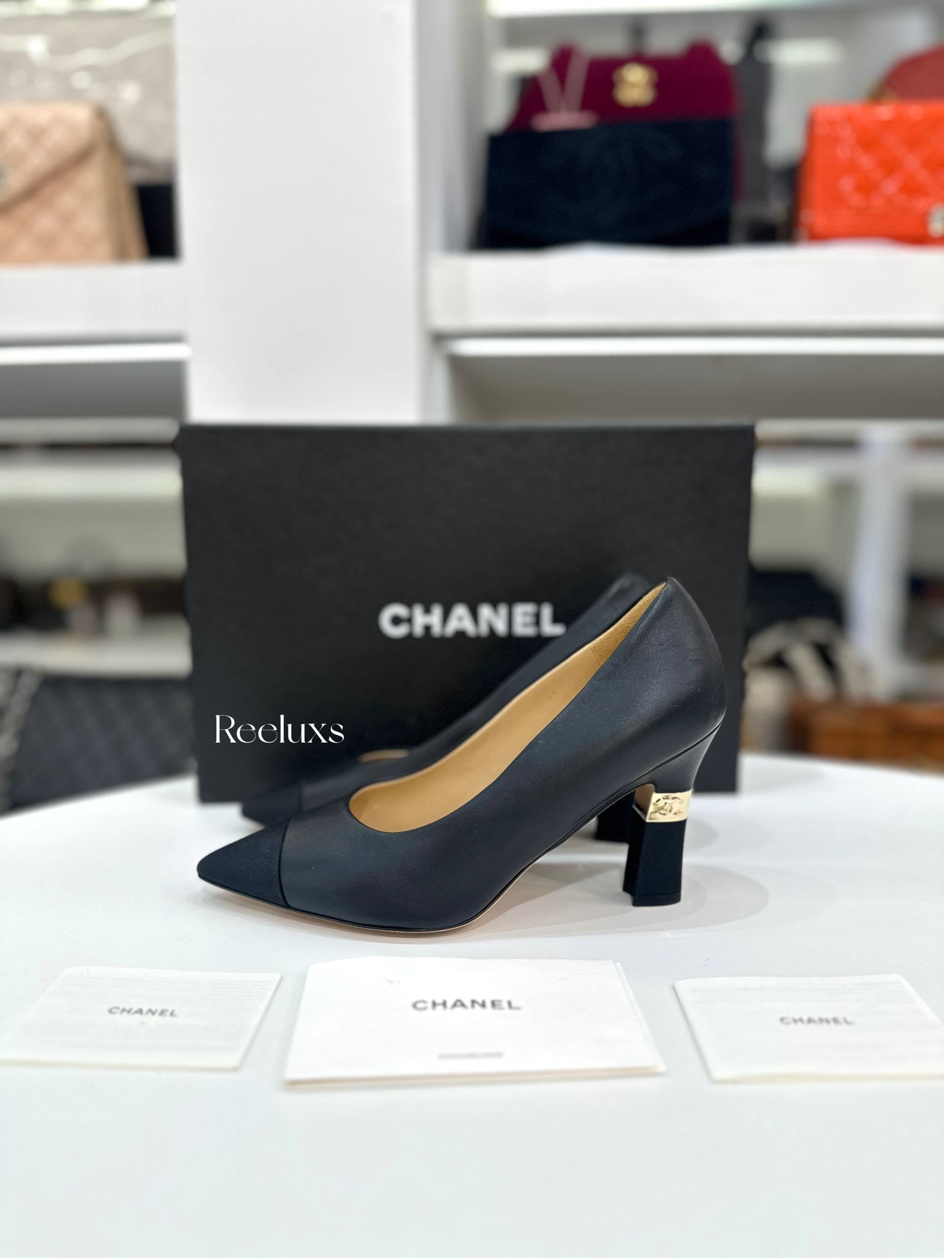 CHANEL Black Leather and Grosgrain Cap-Toe Pumps
