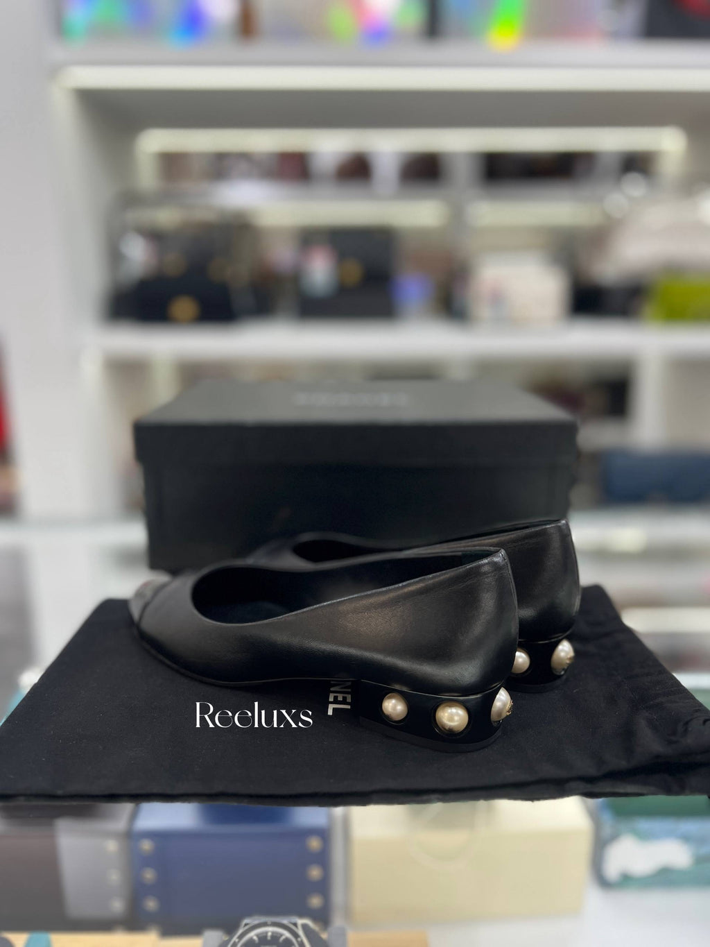 CHANEL Black Leather Cap-Toe Flats With Pearl-Embellished Heel