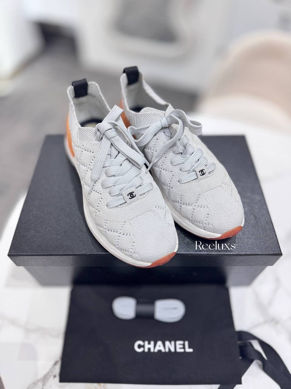 Chanel Quilted Low-Top Sneakers in White Wool