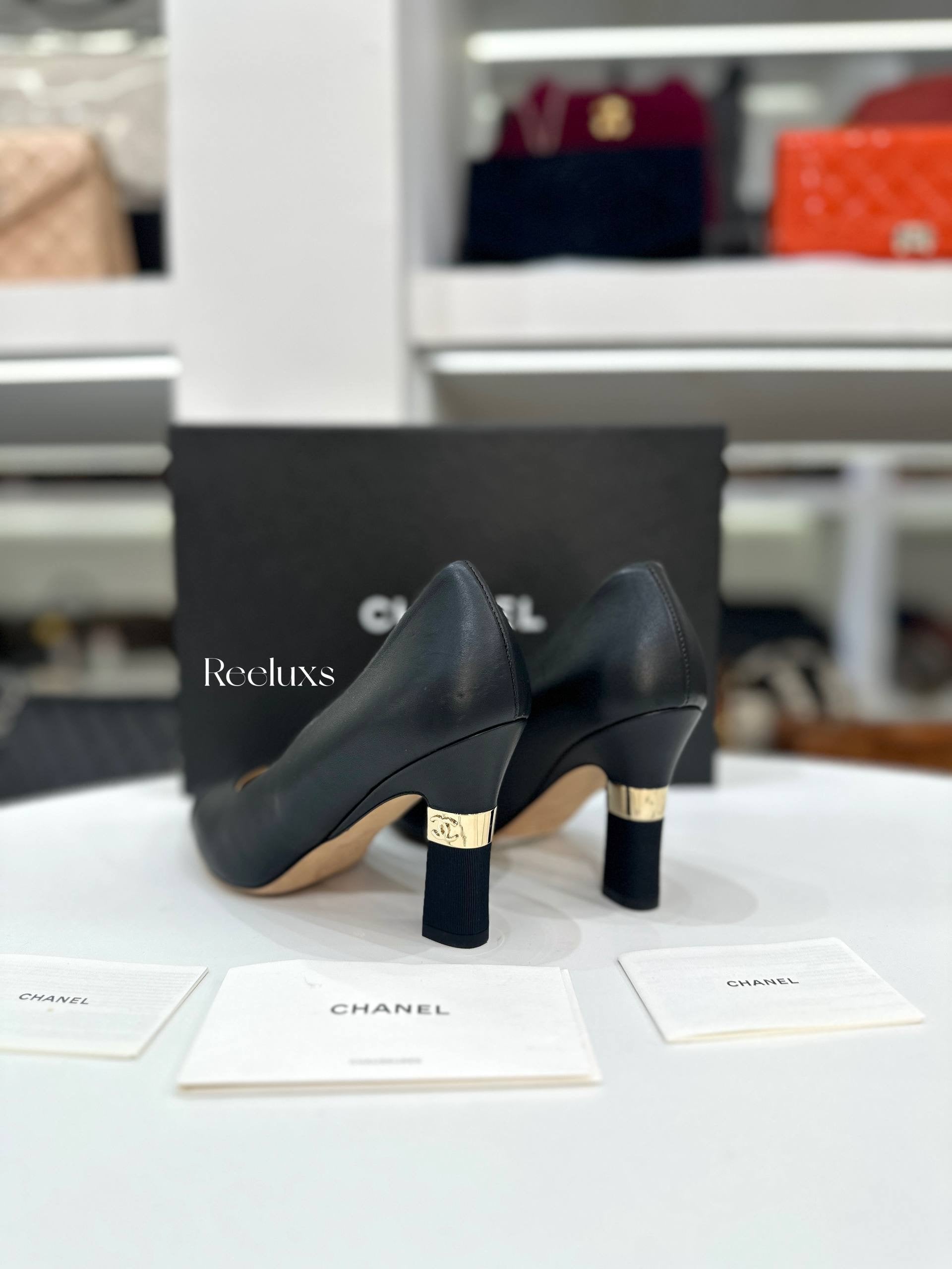 CHANEL Black Leather and Grosgrain Cap-Toe Pumps