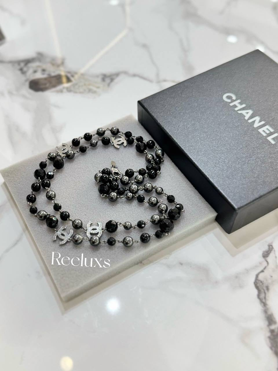 CHANEL Black And Grey Beaded Triple CC Long Necklace