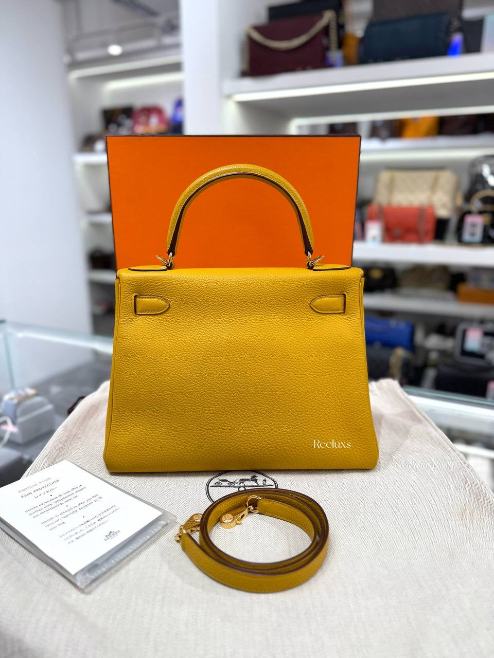 Full set HERMÈS Kelly 28 Retoure Bag in Jaune Ambre Togo GHW