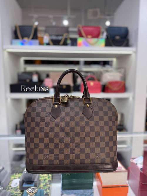 LOUIS VUITTON Alma PM Handbag in Damier Ebene Coated Canvas