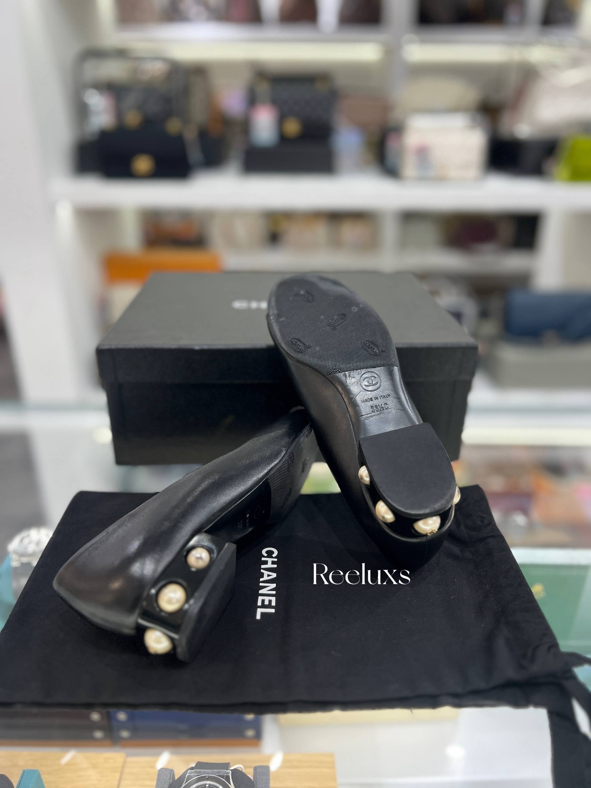 CHANEL Black Leather Cap-Toe Flats With Pearl-Embellished Heel