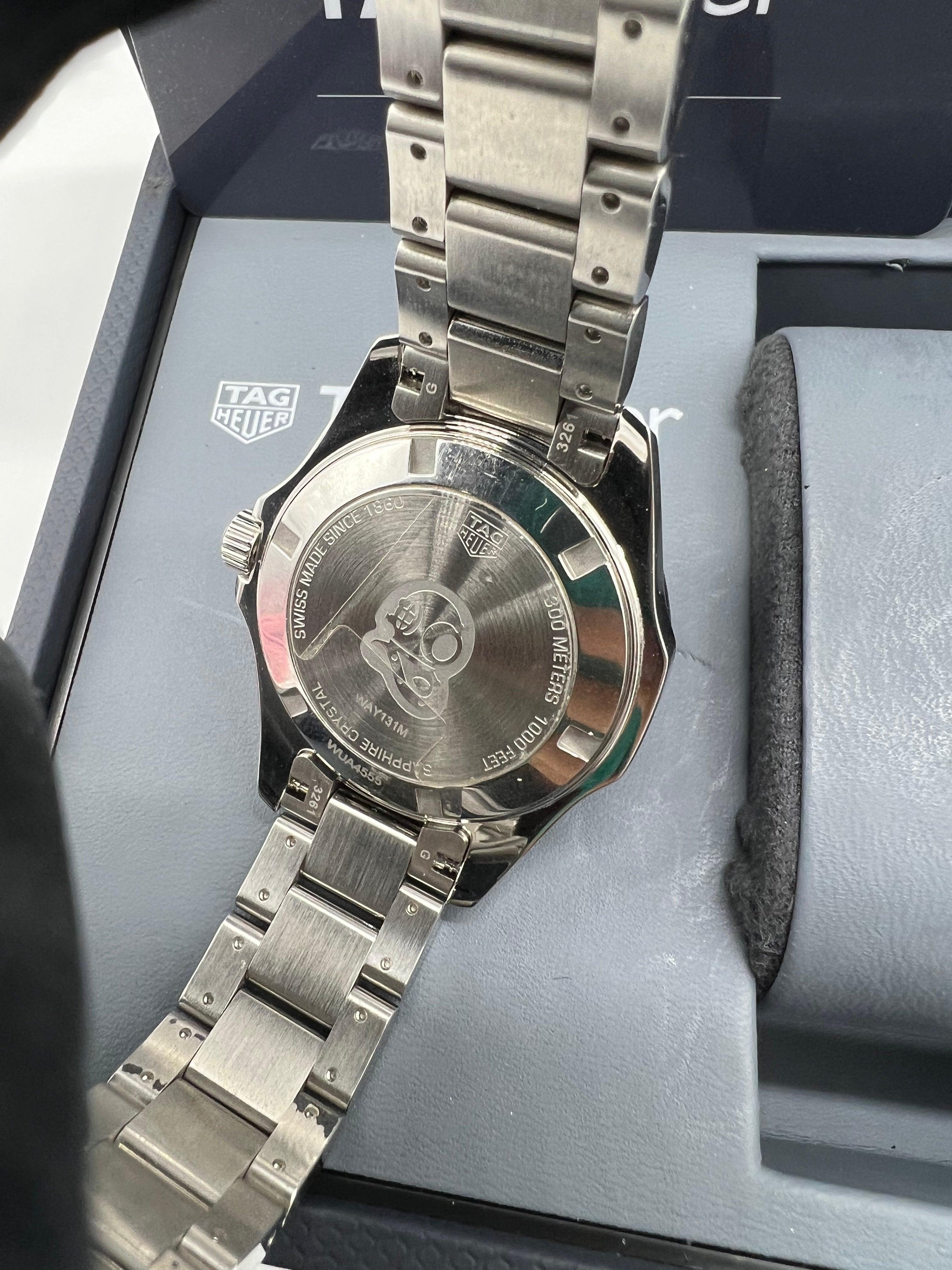 TAG Heuer Aquaracer 300M Quartz Stainless Steel Mid Size Wristwatch with Black Mother of Pearl Diamond Dial and Ceramic Bezel Ref WAY131M - Reeluxs 