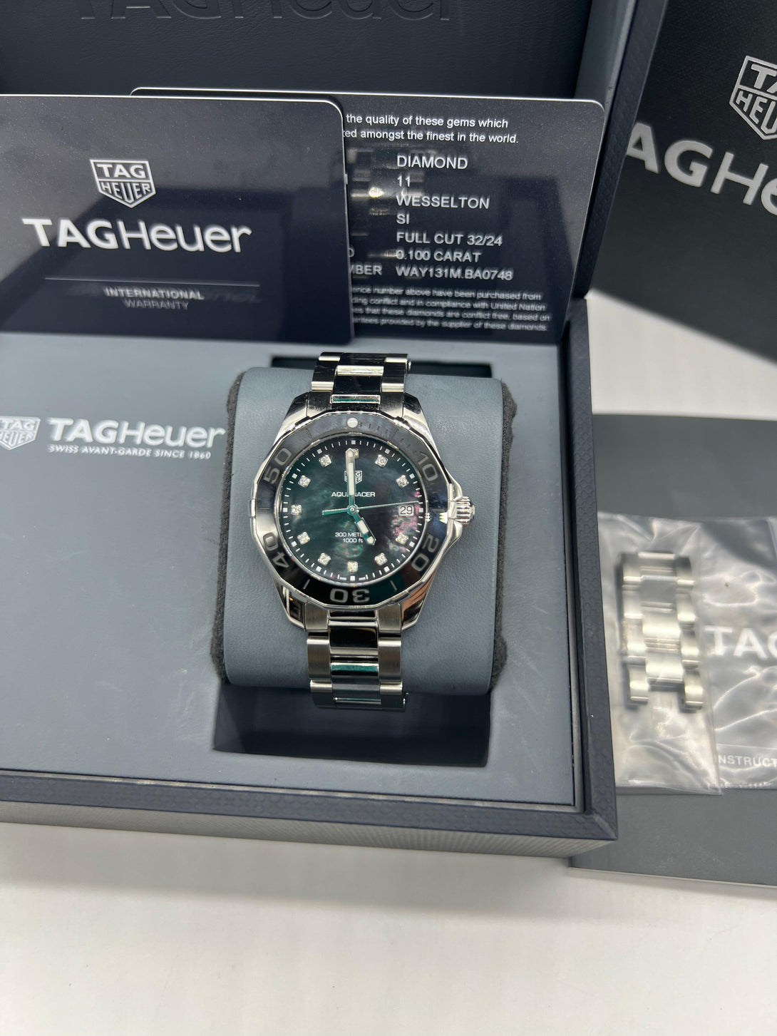 TAG Heuer Aquaracer 300M Quartz Stainless Steel Mid Size Wristwatch with Black Mother of Pearl Diamond Dial and Ceramic Bezel Ref WAY131M - Reeluxs 