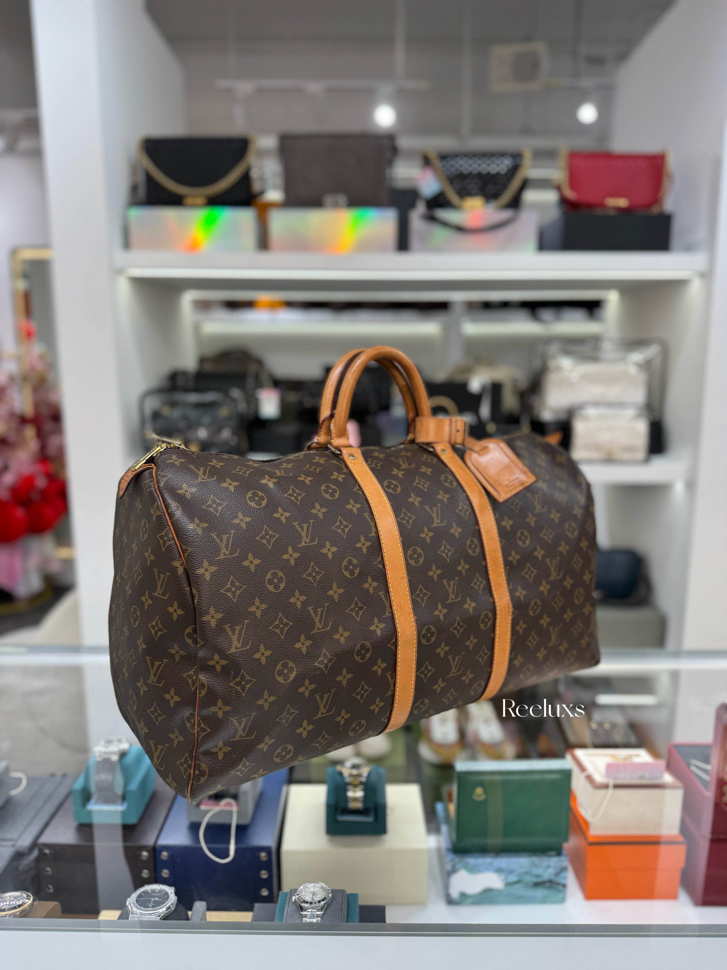 LOUIS VUITTON Keepall 55 Bandoulière Travel Bag