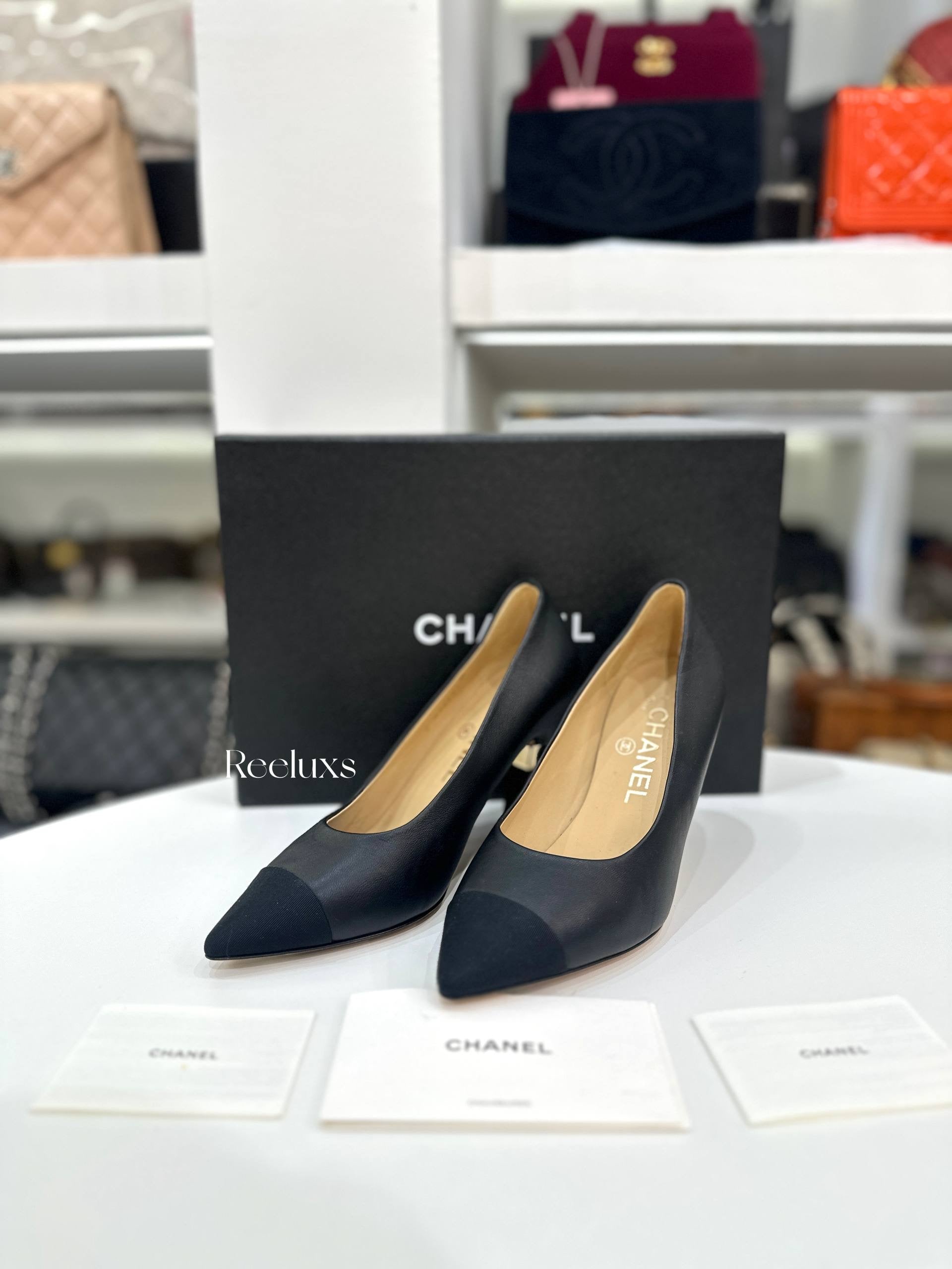 CHANEL Black Leather and Grosgrain Cap-Toe Pumps