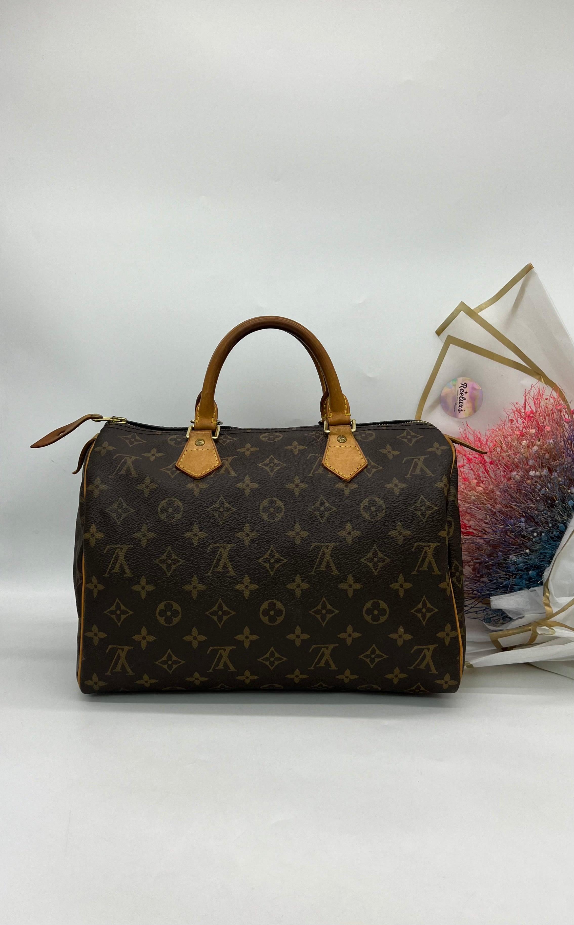 LOUIS VUITTON Speedy 30 Ladies Handbag - Reeluxs 