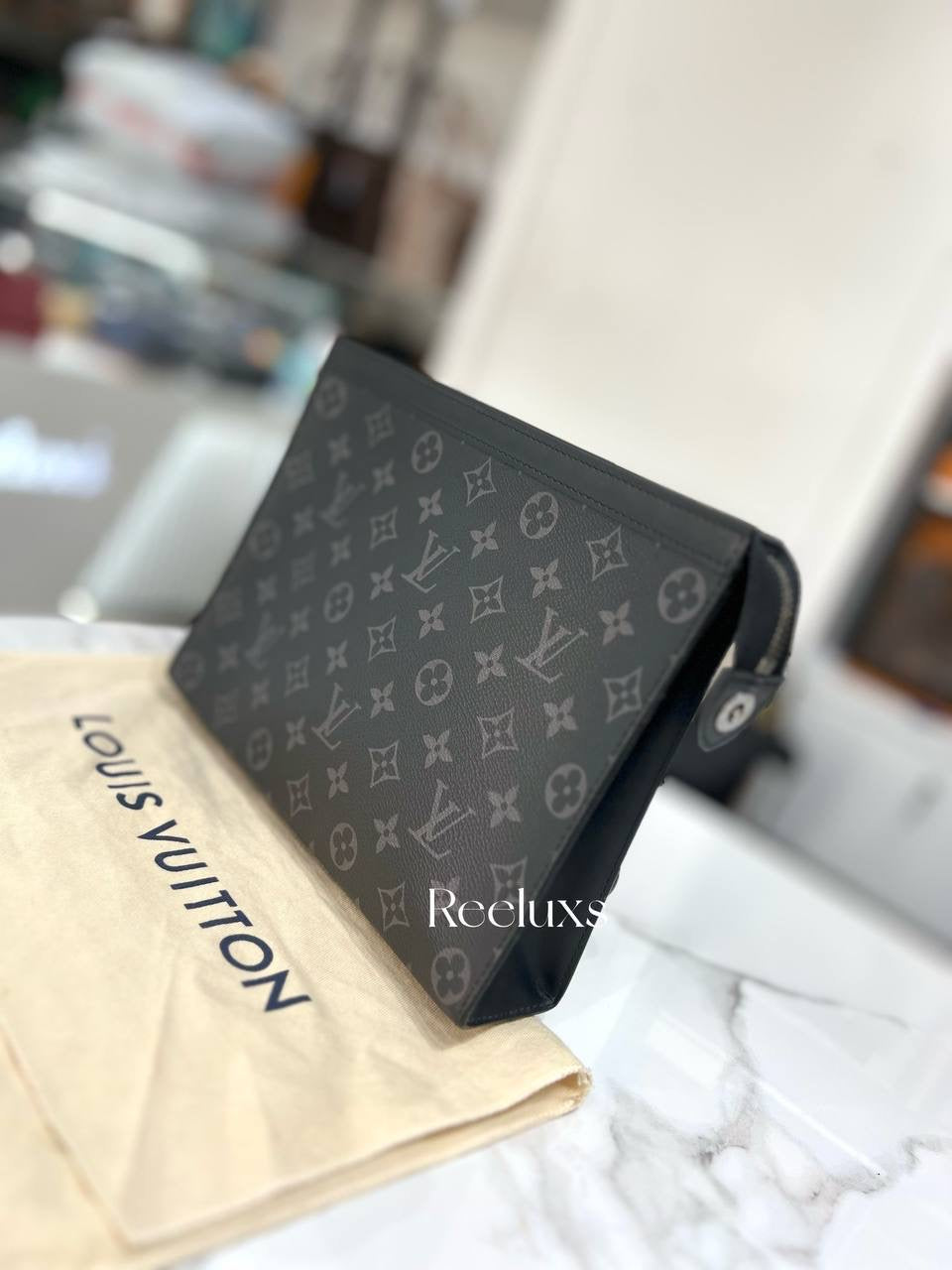 LOUIS VUITTON Pochette Voyage MM in Monogram Eclipse Canvas