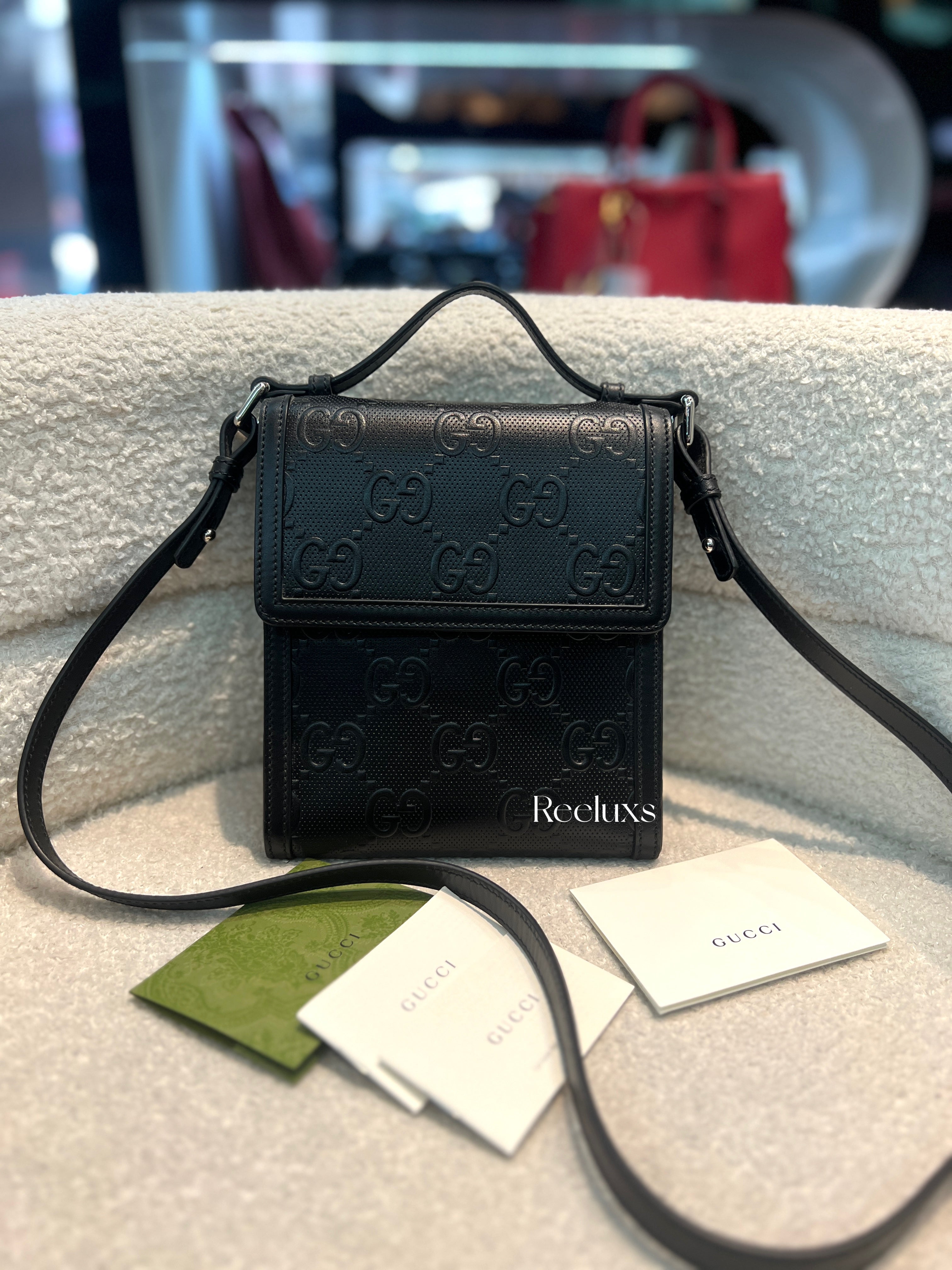 GUCCI GG Embossed Messenger Bag