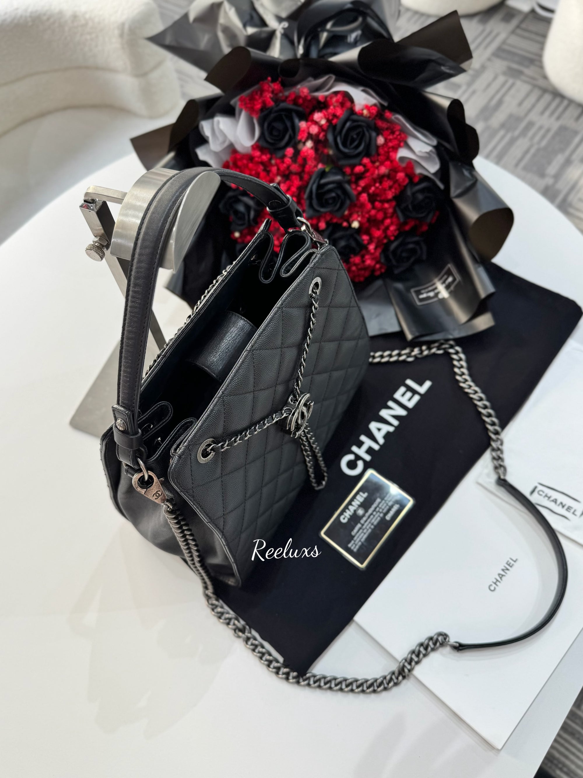 CHANEL Black Quilted
Caviar Leather CC Large Accordion Bucket Bag