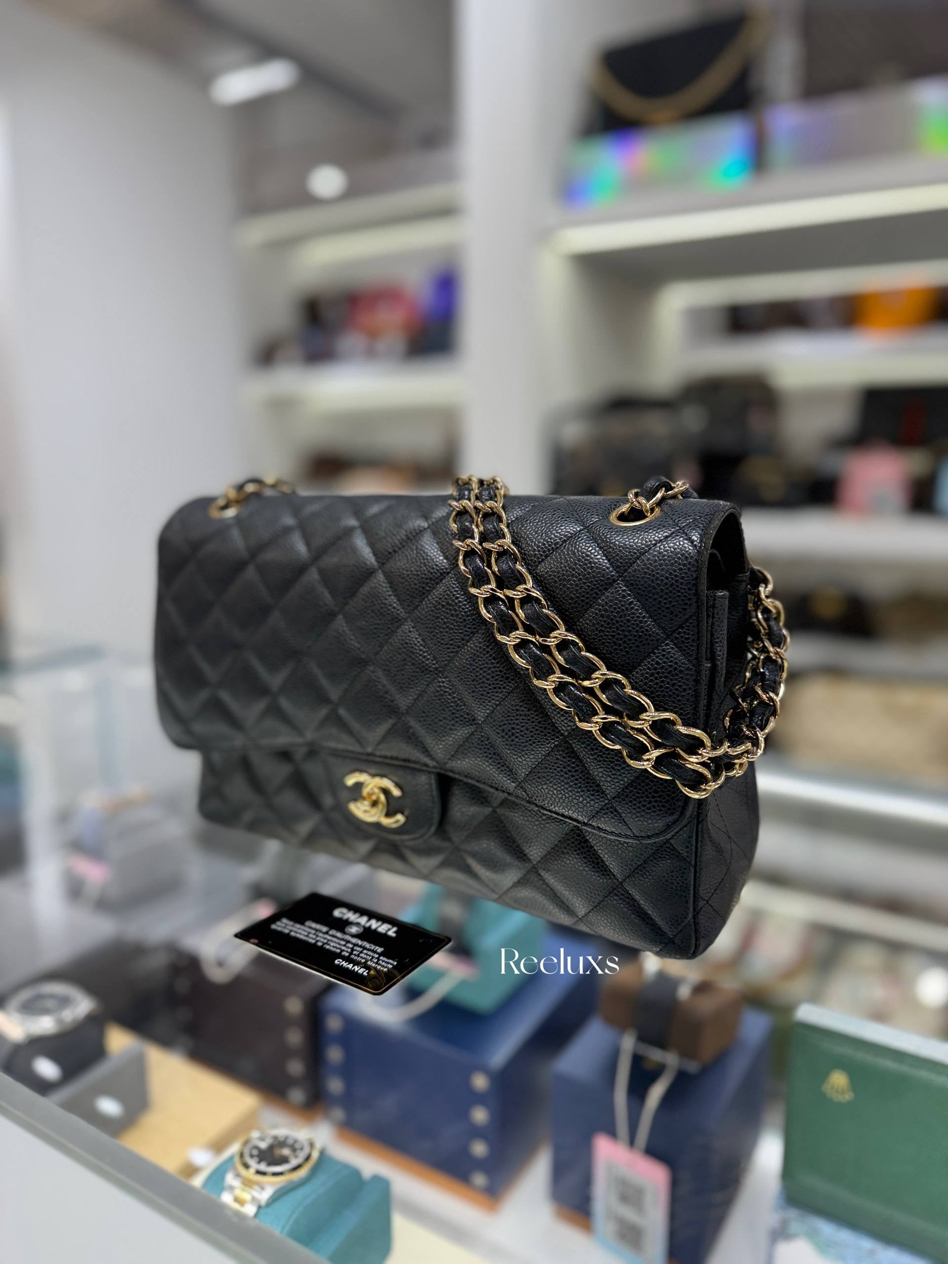 CHANEL Classic Jumbo Flag Bag In Black Quilted Caviar Leather