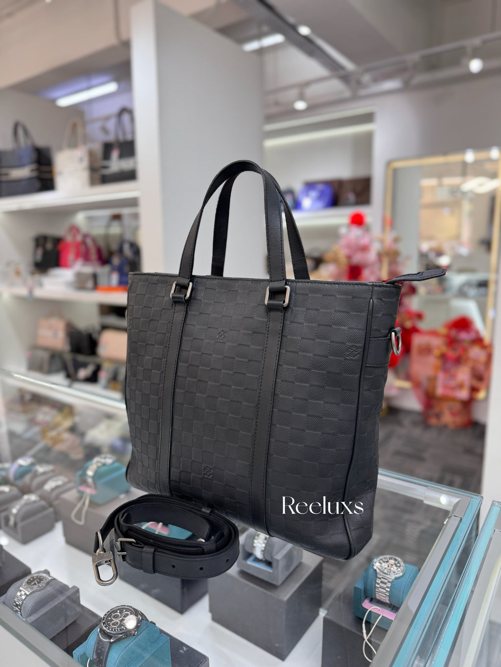 LOUIS VUITTON Tadao PM in Damier Infini