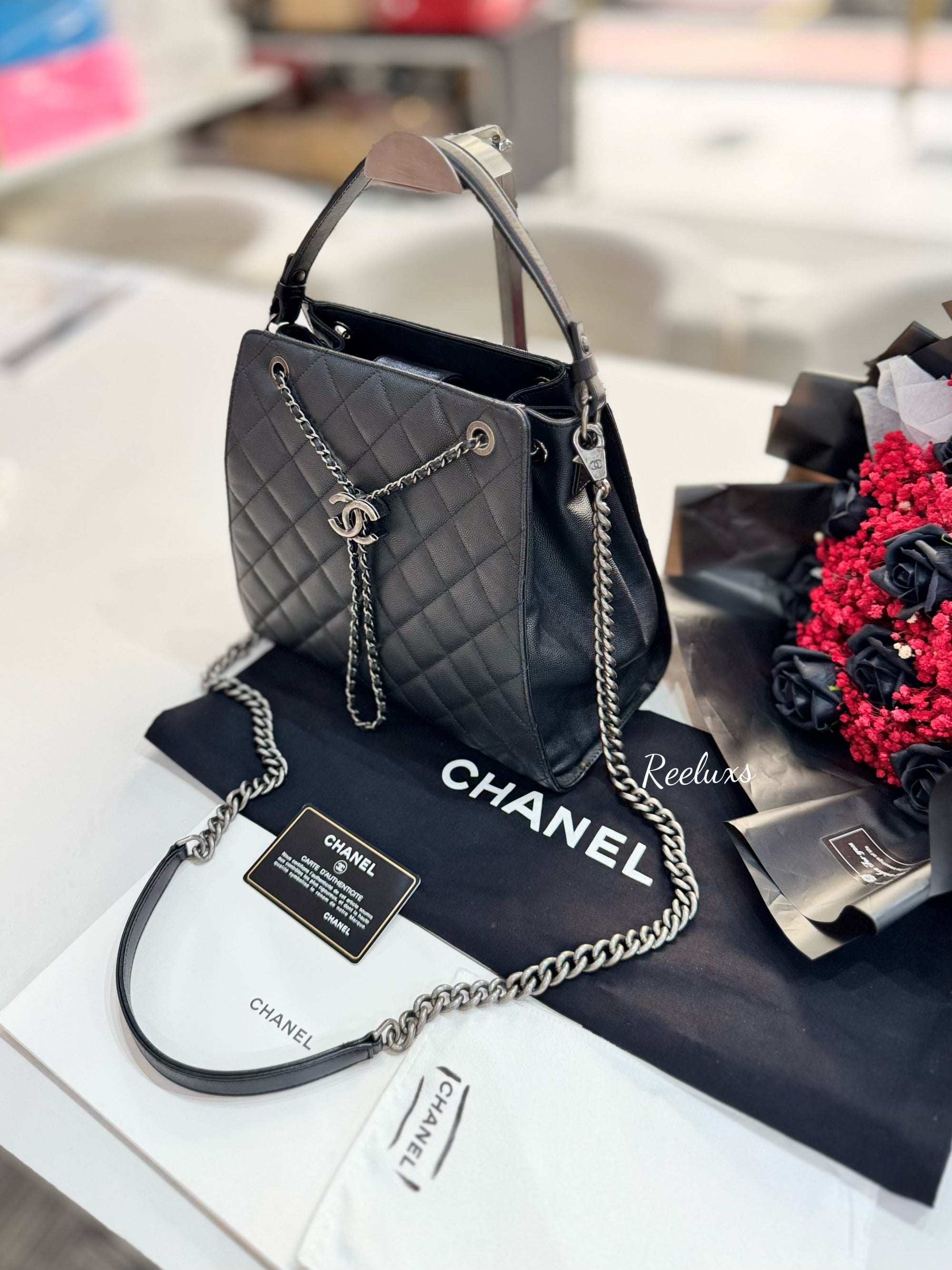 CHANEL Black Quilted
Caviar Leather CC Large Accordion Bucket Bag