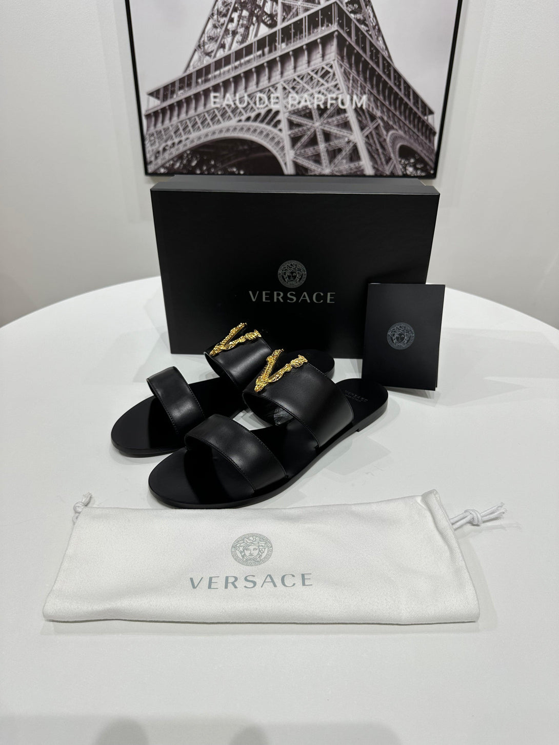 VERSACE
Black Virtus Flat Sandals - Reeluxs 