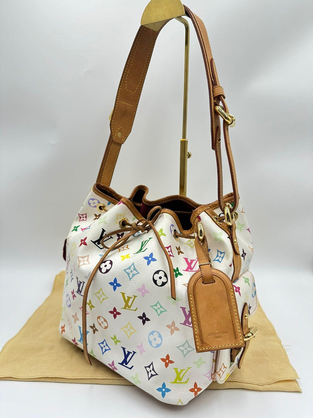 LOUIS VUITTON
Limited Edition Takashi Murakami X White Monogram Multicolore Noe Petite MM - Reeluxs 