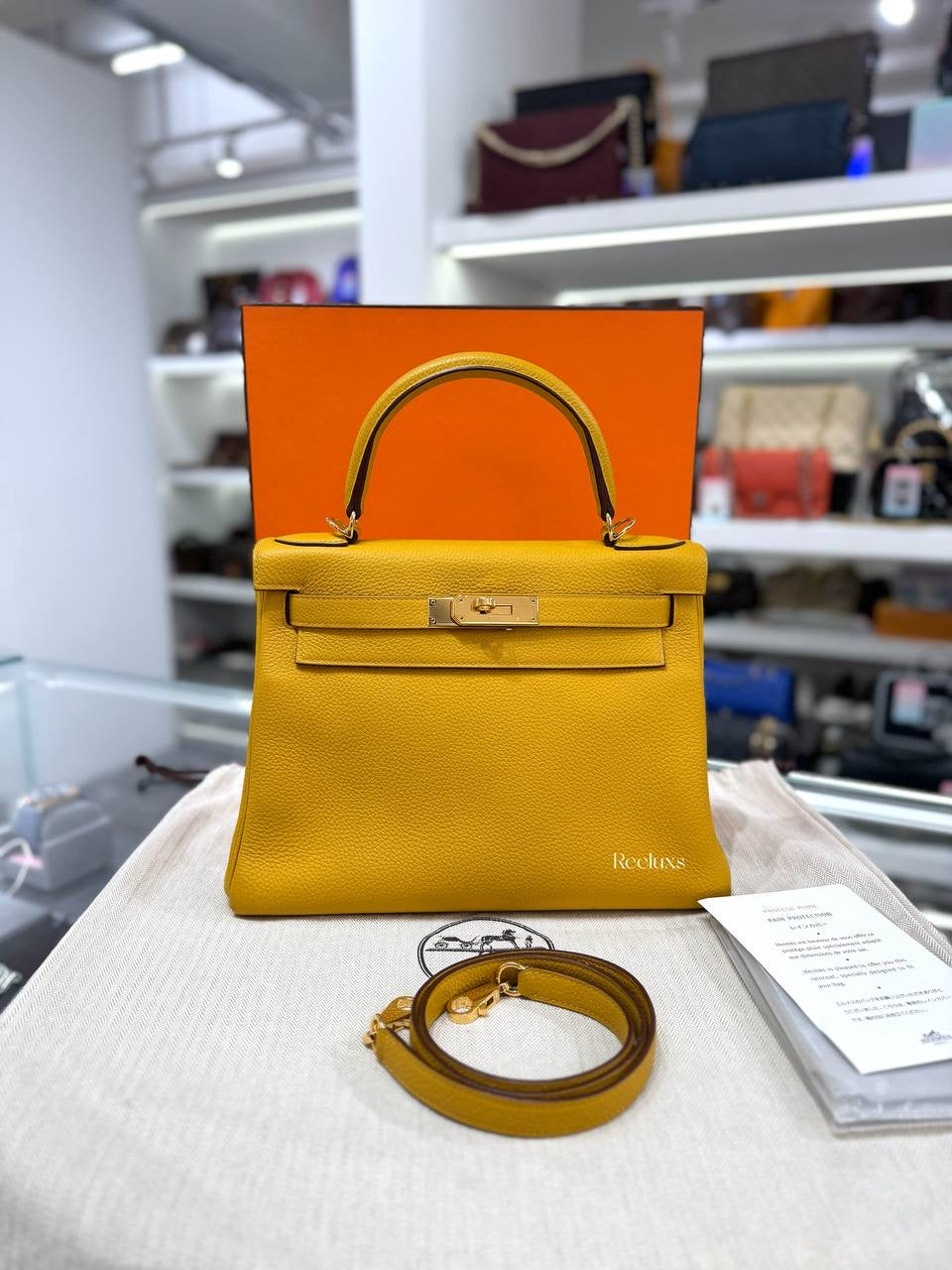 Full set HERMÈS Kelly 28 Retoure Bag in Jaune Ambre Togo GHW