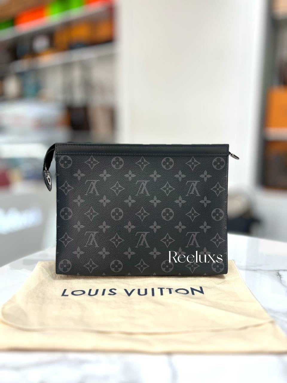 LOUIS VUITTON Pochette Voyage MM in Monogram Eclipse Canvas
