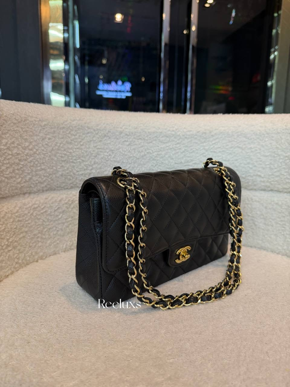 Chanel Classic Flap Bag in Black Caviar leather with gold-tone hardware
