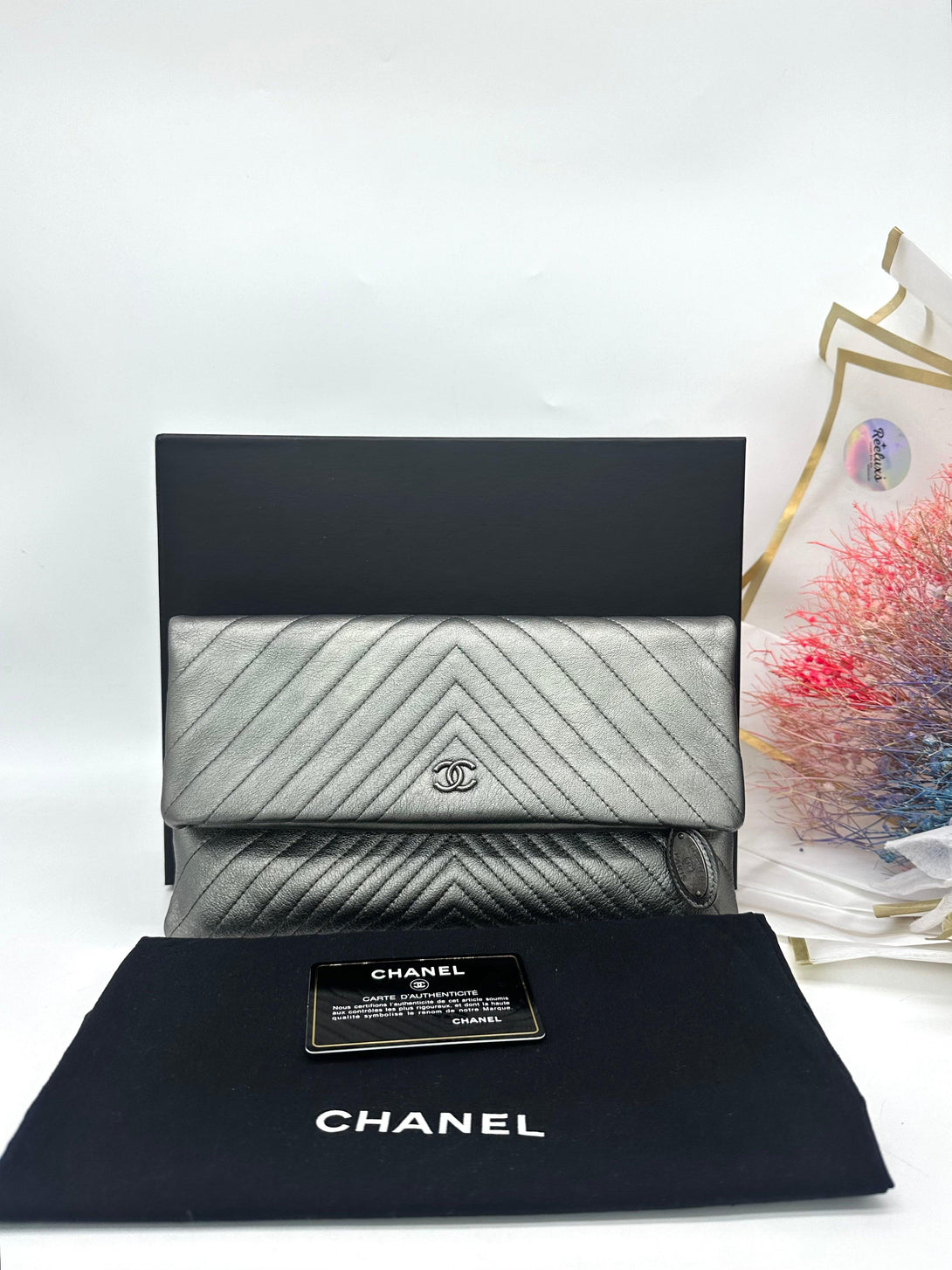 CHANEL CC Silver Metallic Flap Clutch - Reeluxs 