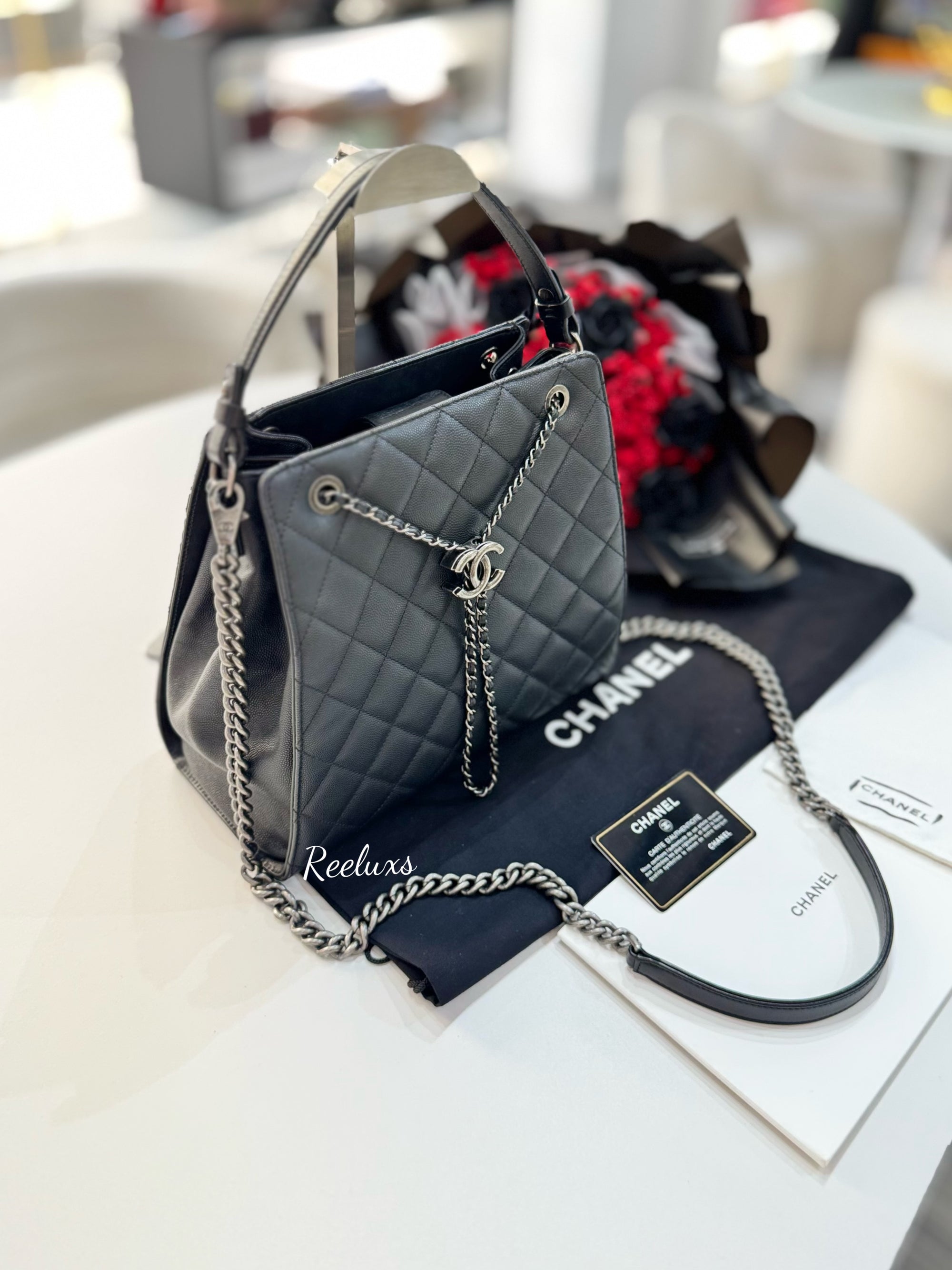 CHANEL Black Quilted
Caviar Leather CC Large Accordion Bucket Bag