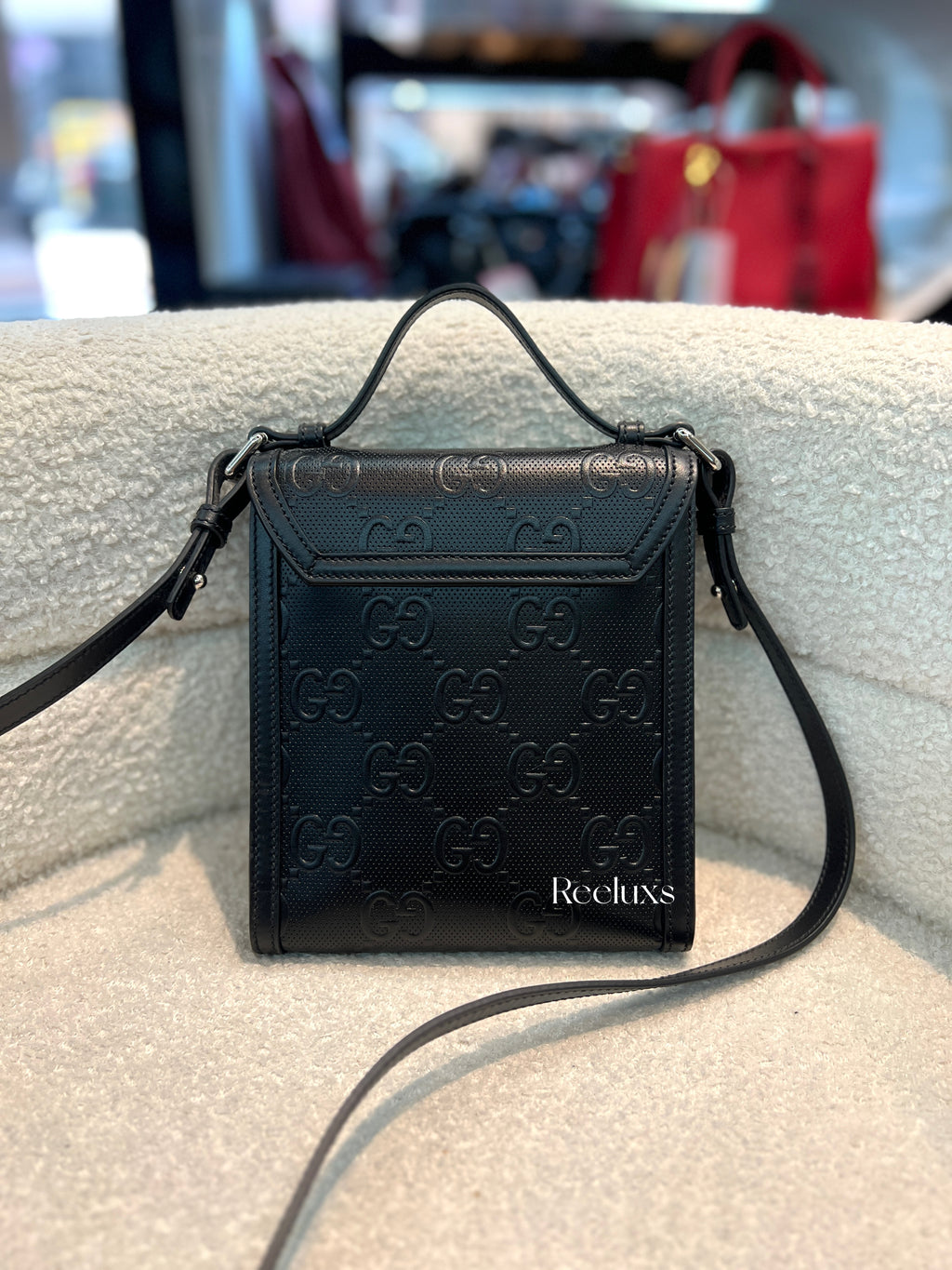 GUCCI GG Embossed Messenger Bag