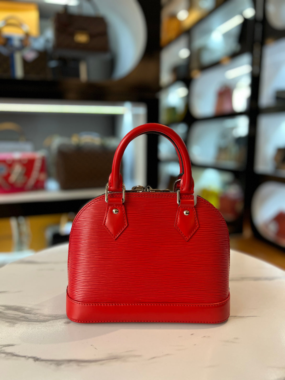 LOUIS VUITTON Epi Alma PM Rouge Red For Women Sling Bag - Reeluxs 